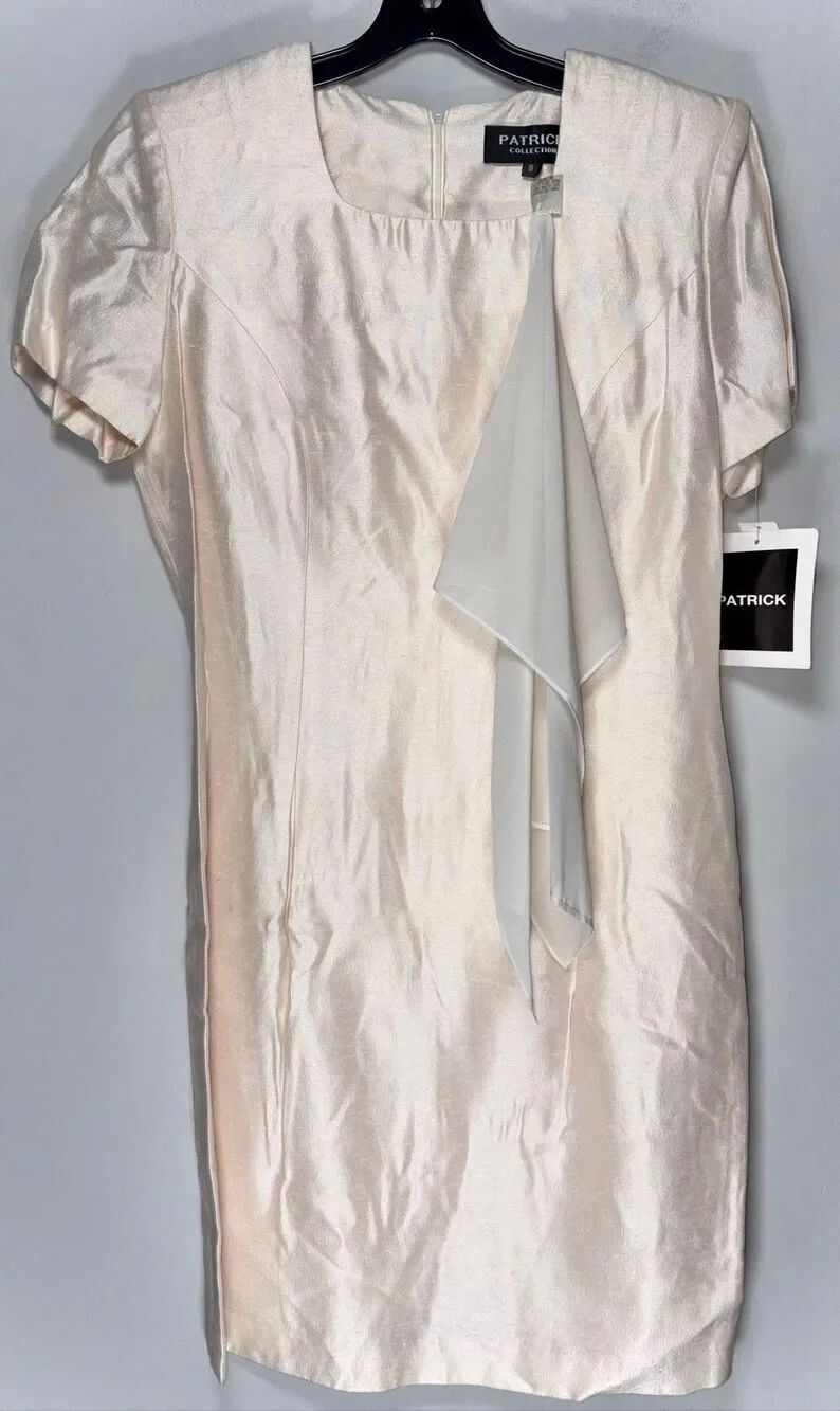 Patrick Collection dress features an ivory silk material with a unique asymmetri